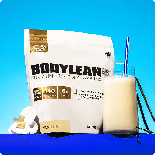 BodyLean25® Vanilla Gusset Bag sitting on a blue background next to a mixed vanilla protein shake and a vanilla flower.
