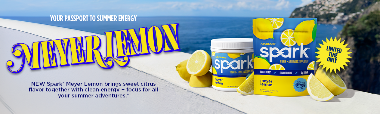 Spark Meyer Lemon Canister and Stick Packs next to sliced lemons on a archway with a Mediterranean city background.