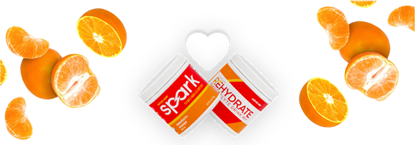 A Spark and Rehydrate canister with a white heart above it and oranges on the side.