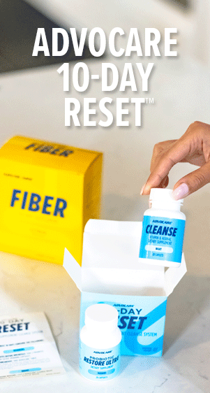 Advocare 10-Day Reset&trade;. 10-Day Reset boxes on a table. The 10-Day Reset is open and the Cleanse bottle is being taken out of it