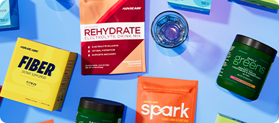 AdvoCare products spread across a blue table.