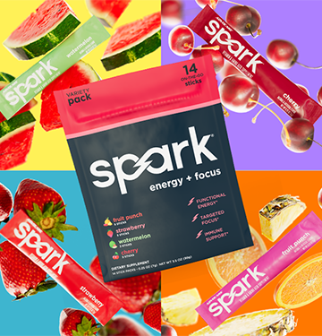 Spark Tropical Variety Pack surrounded by the different flavor stick packs and the fruit representations.