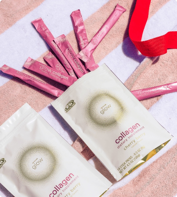 Bag of Glow Collagen stick packs spilling out onto a beach towel.