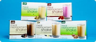 AdvoCare Meal Replacement Shake packages stacked on each other against a blue background.