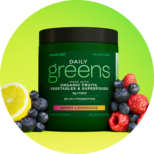 Daily Greens Berry Lemonade canister surrounded by sliced lemons and berries.