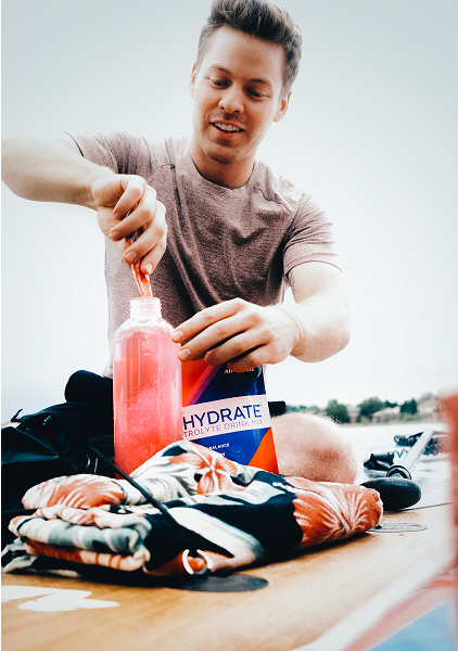 Sports Performance - Man scooping AdvoCare Creatine+